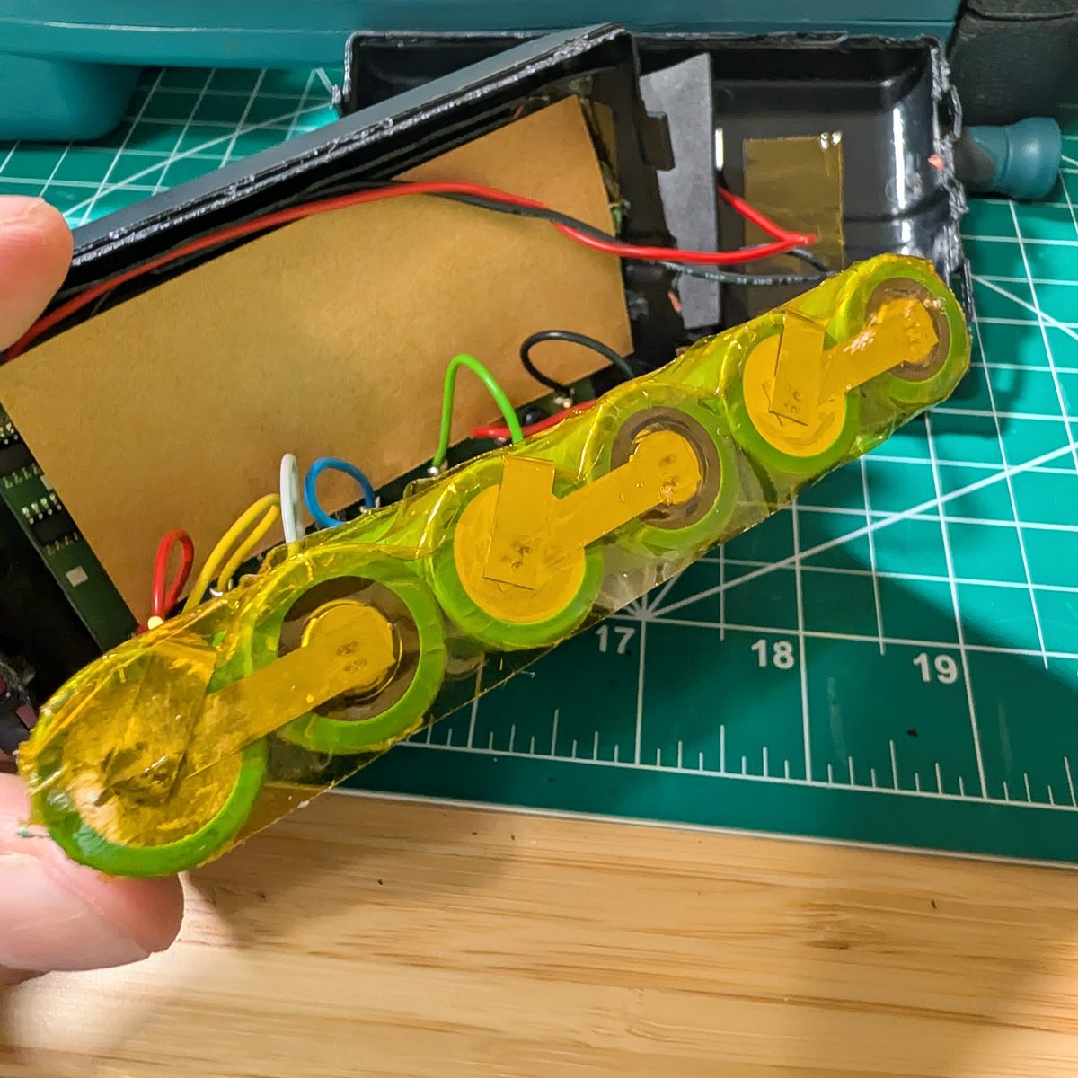 Rebuilt NAO cell string with nickel strip spot-welded between cells and the battery management board reconnected