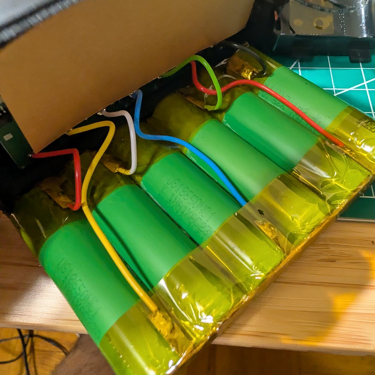 Close-up of balance wiring and spot-welded nickel links on a rebuilt NAO battery pack