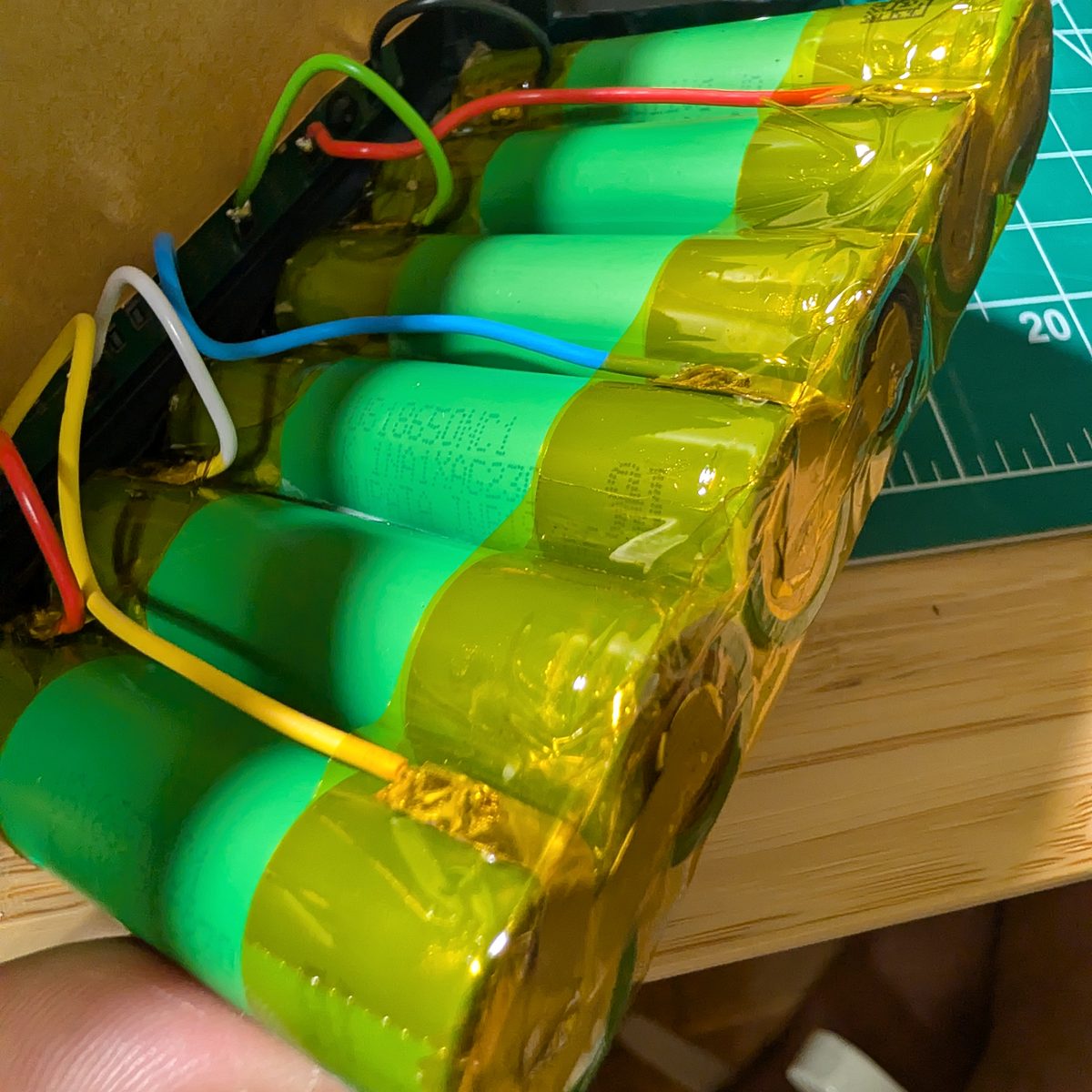 Completed six-cell 18650 string for a NAO battery pack, insulated and wired, ready for reassembly